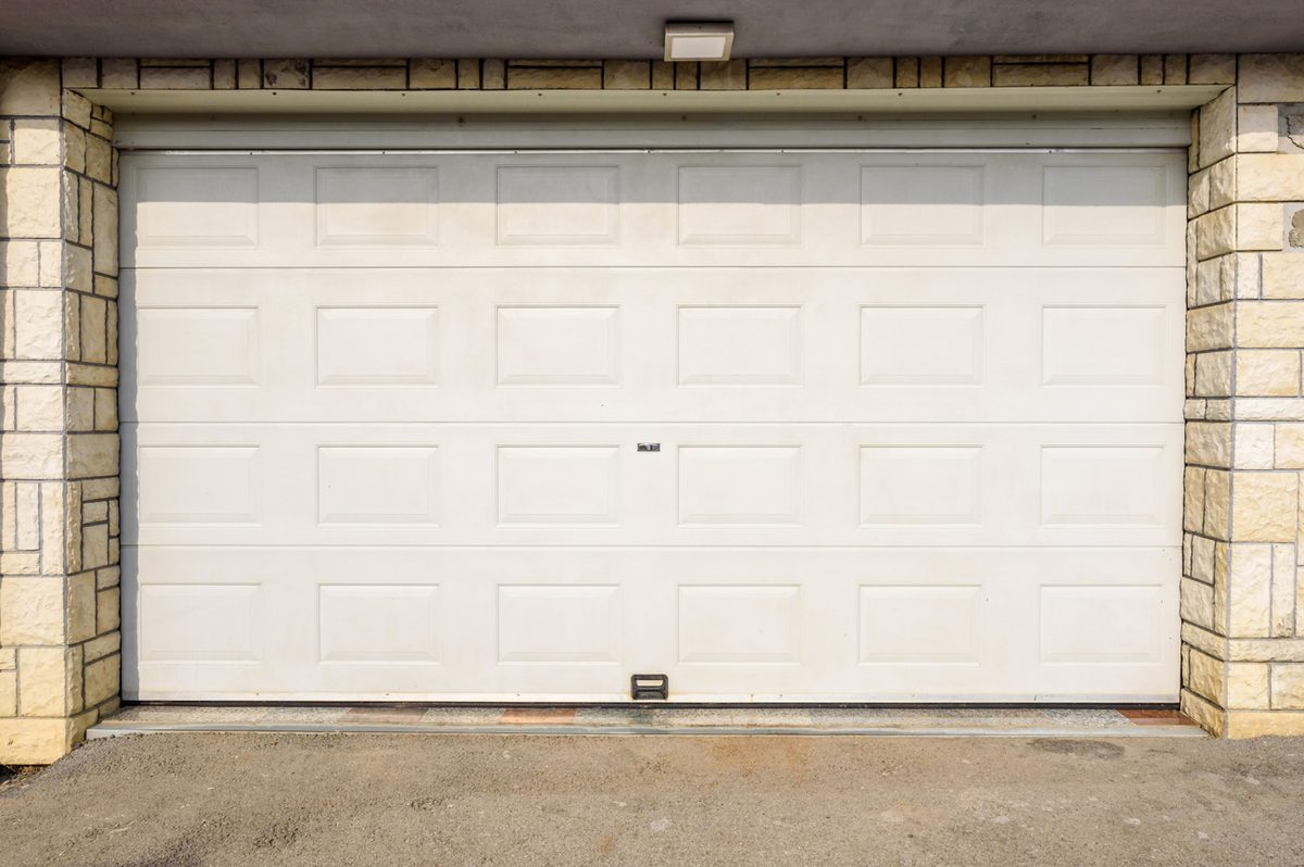 Stone-trim garage door installed in Oliver, PA by Bear Door Services