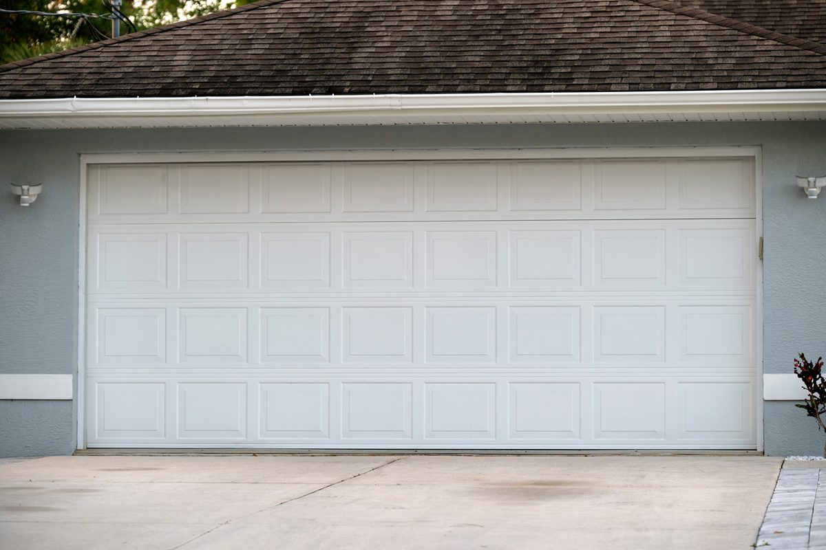 Clean white garage door installed in Hopwood, PA by Bear Door Services