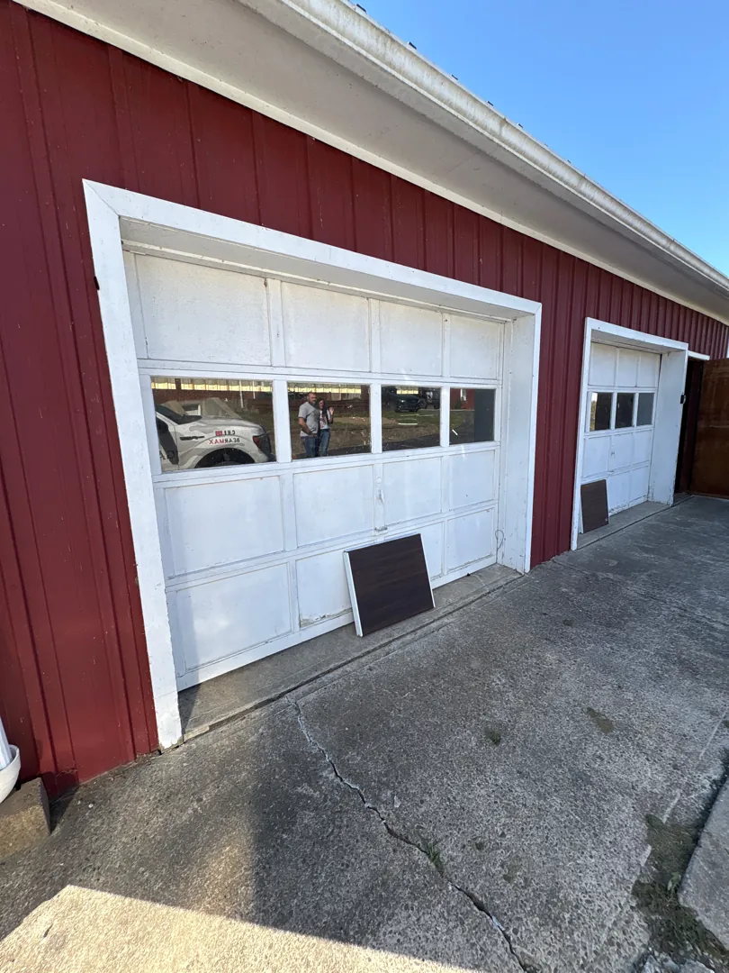 Woodgrain CHI Carriage — before, faded white doors on a red barn