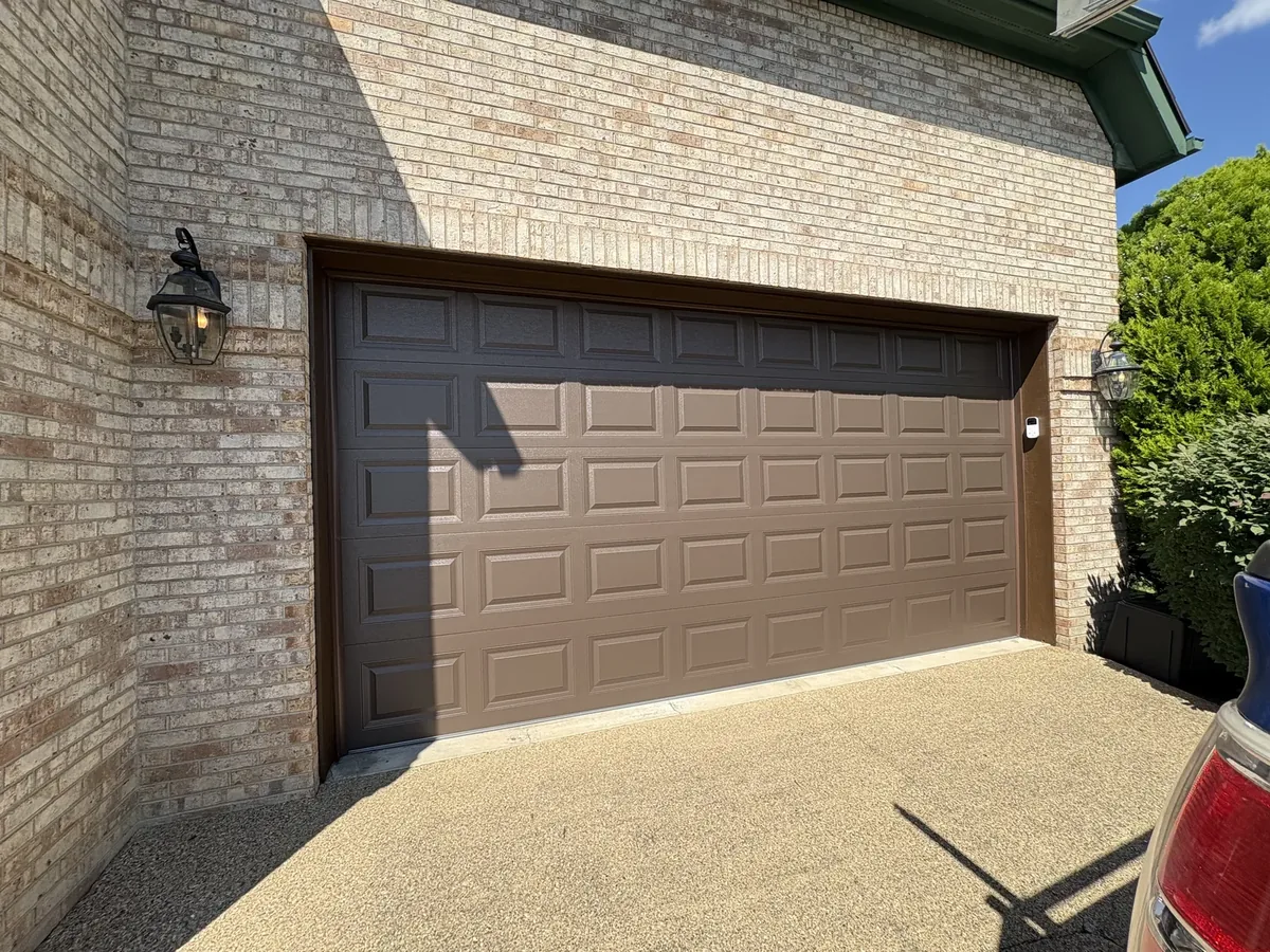 Woodgrain CHI & Brown Trim garage after — Dated doors replaced with woodgrain CHI doors and crisp new brown trim.