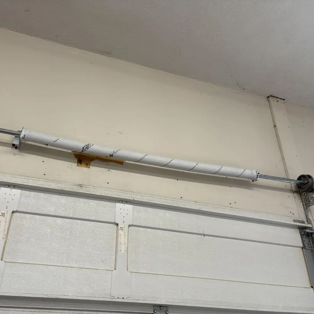 Newly installed BEARMAX torsion spring by Bear Door Services