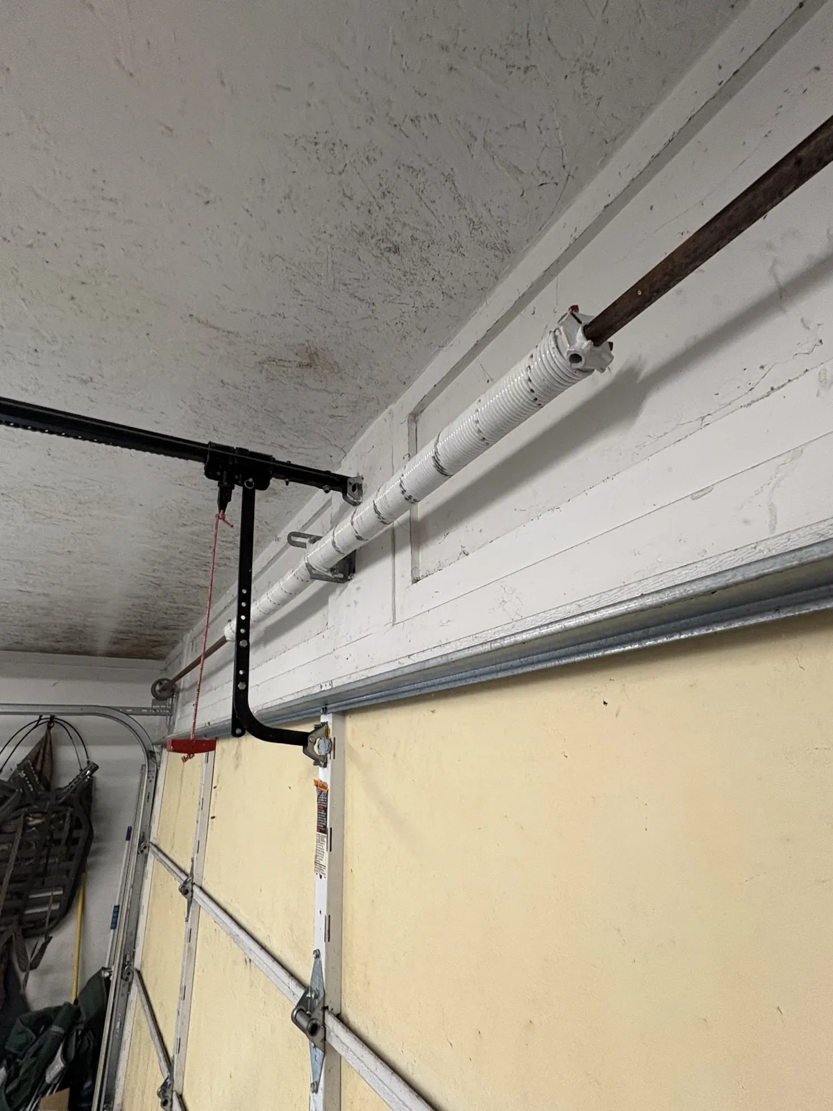 A broken torsion spring replaced with a BEARMAX premium spring