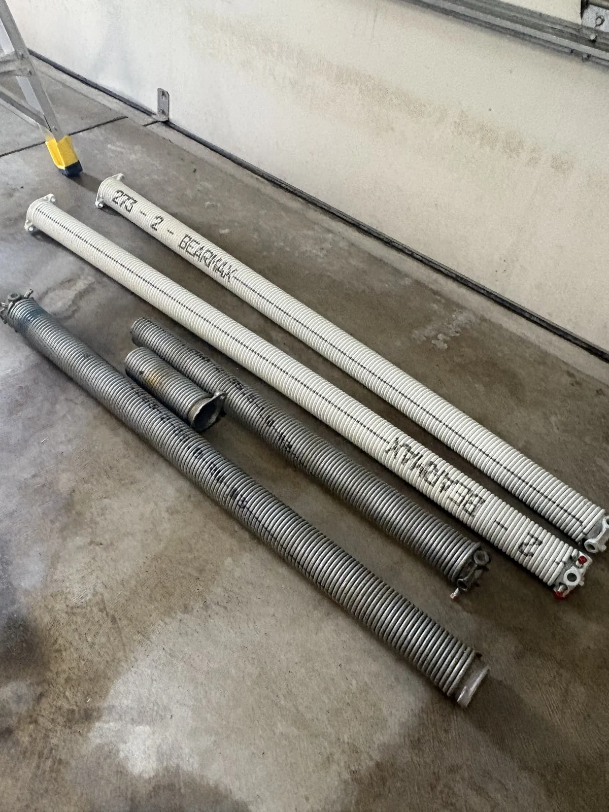 Old galvanized springs compared with new BEARMAX torsion springs
