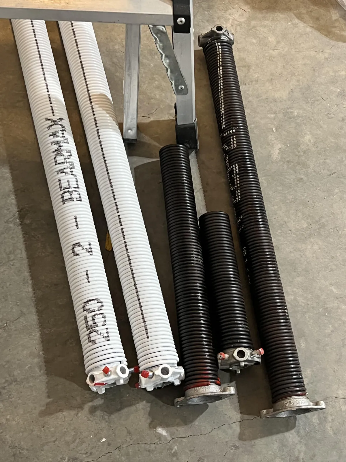 Cheap steel springs compared with premium BEARMAX torsion springs